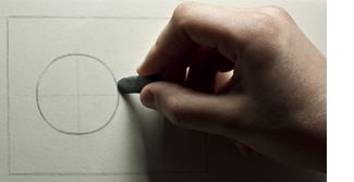 Erasing excess pencil marks on the outside of the sphere.